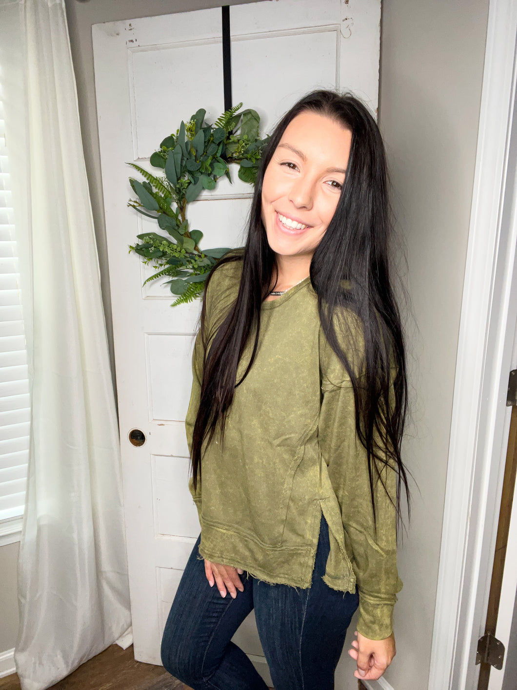 Acid wash exposed seam pull over in olive or