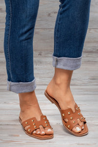Tan studded brown flip flops